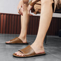 Men's brown leather casual sandals with a textured rubber sole on a neutral background.