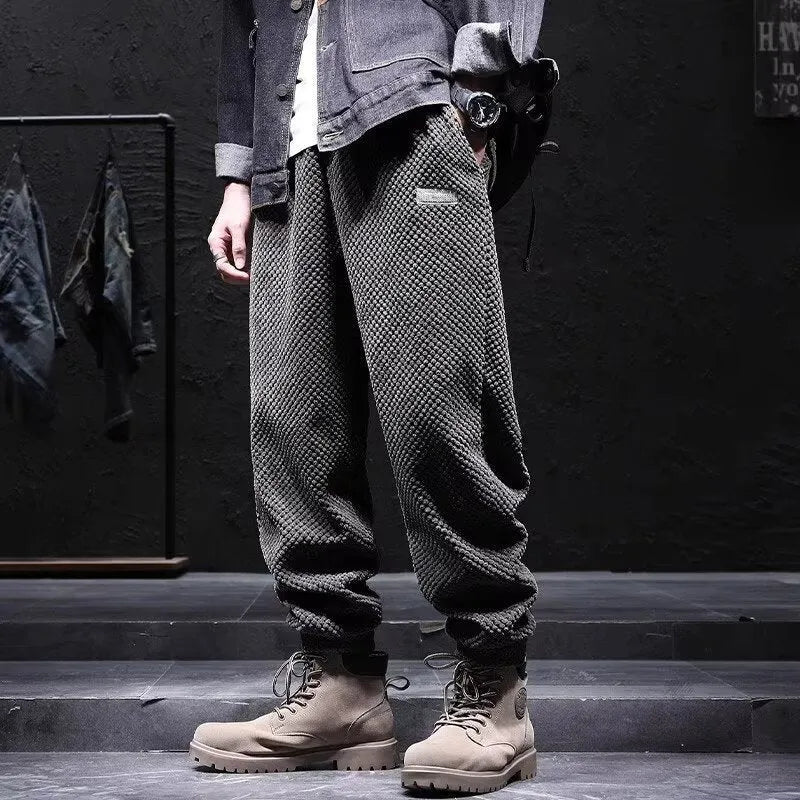 Men's grey ankle-tied casual sport sweatpants with straight leg design on hanger