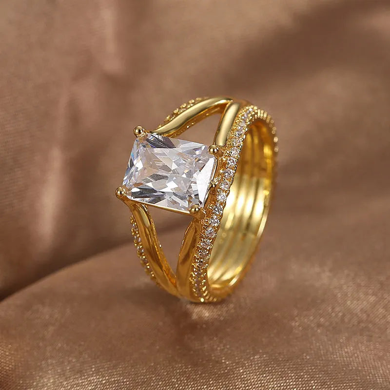 Geometric women's ring with square zircon stone and gold electroplated finish on copper
