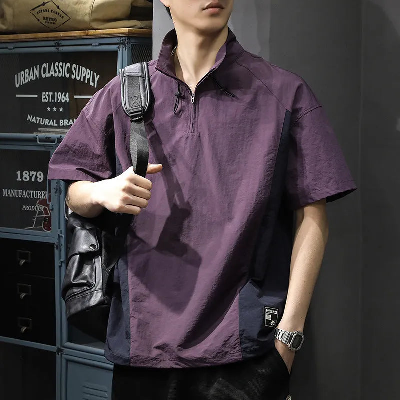 Brown men's half-zip stand collar casual shirt with short sleeves on a hanger.