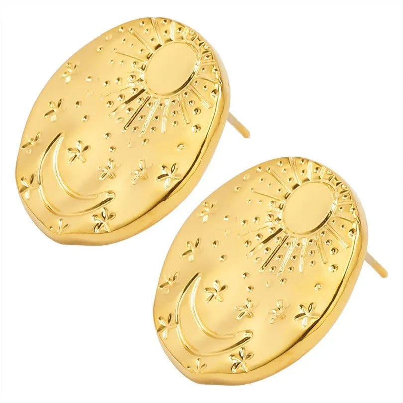 A pair of 304 stainless steel stud earrings with a geometric shape and shell detail in a gold or silver electroplated finish.