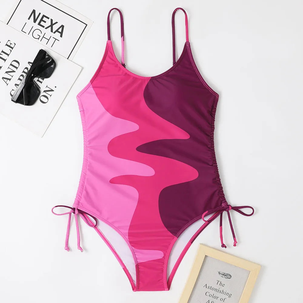 Women's sleeveless backless one-piece swimsuit in blue striped print