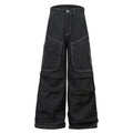 Black pleated workwear jeans with multiple pockets showing mid-waist fit and zip placket opening
