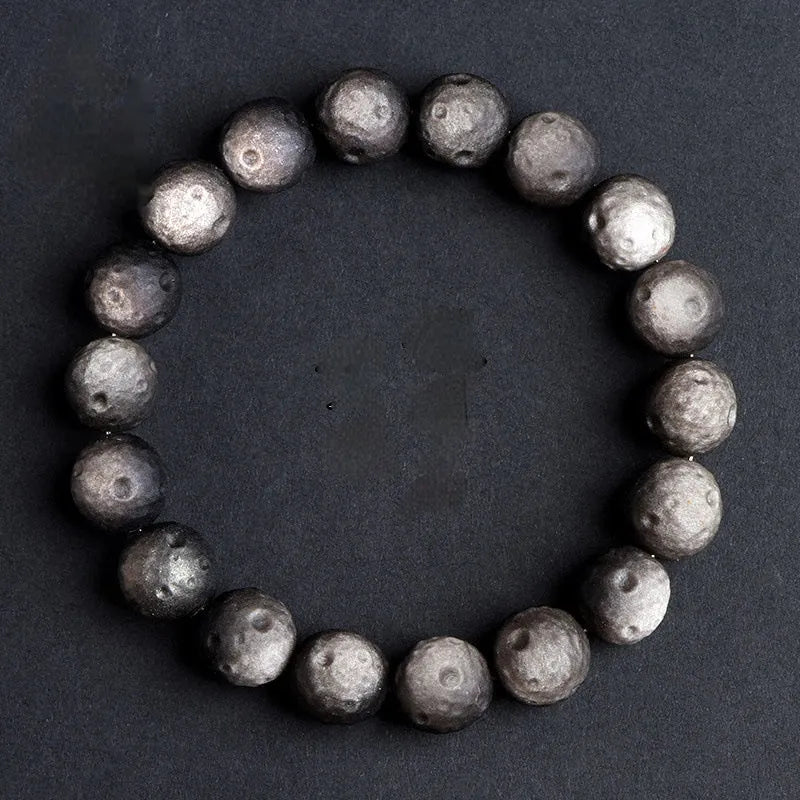 Natural obsidian crater ball bracelet with meteorite texture in silver stone and gold obsidian colour variations