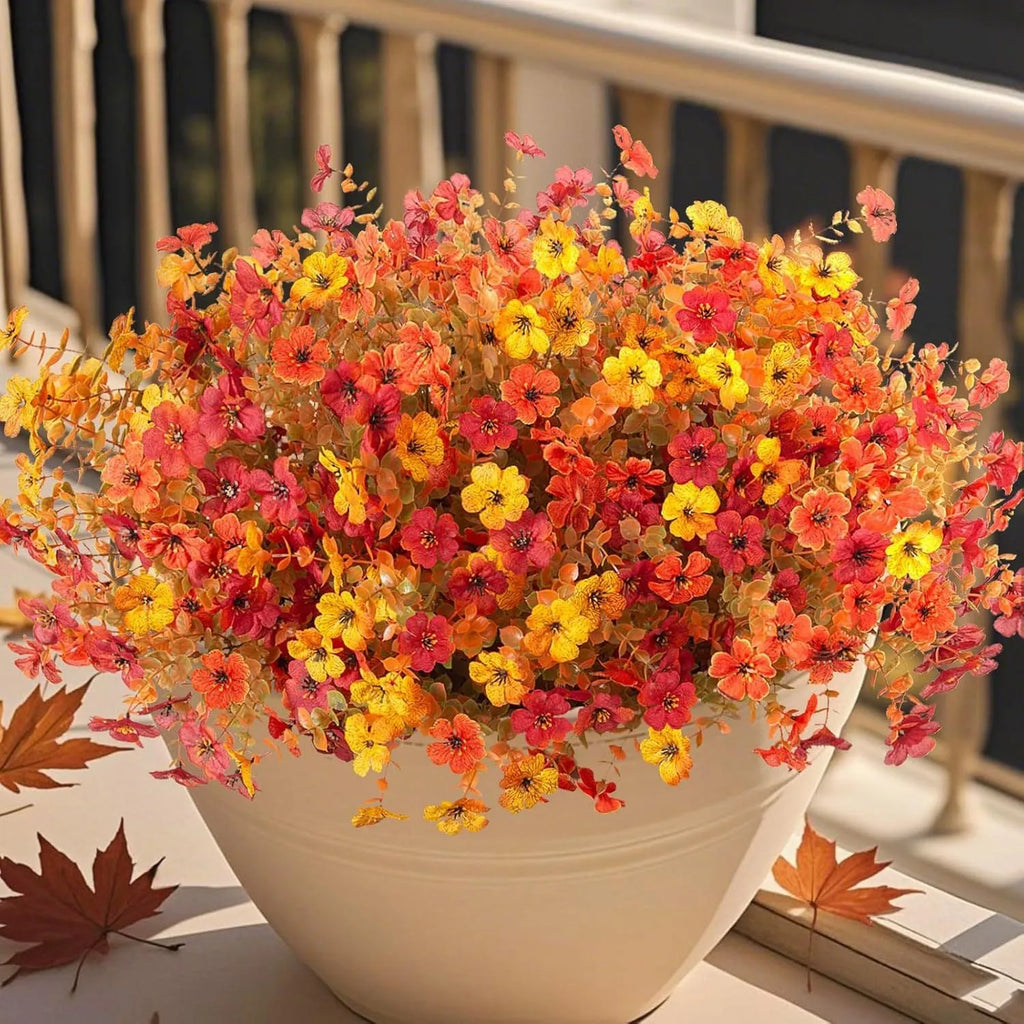 Plastic artificial flower bouquet with silk details in autumn orange, orange yellow, red or yellow for home and wedding decoration