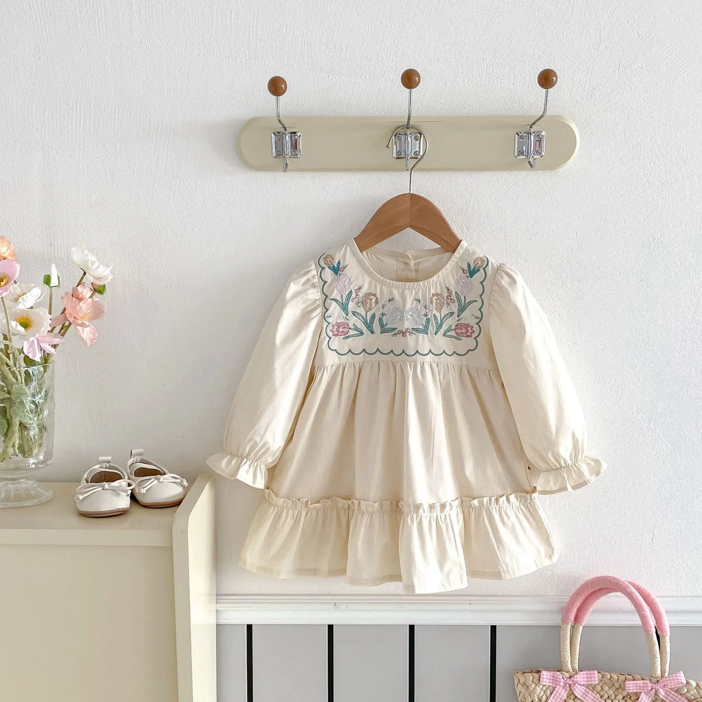 Girls' ruffled long sleeve flower embroidered princess dress in apricot colour on a child model