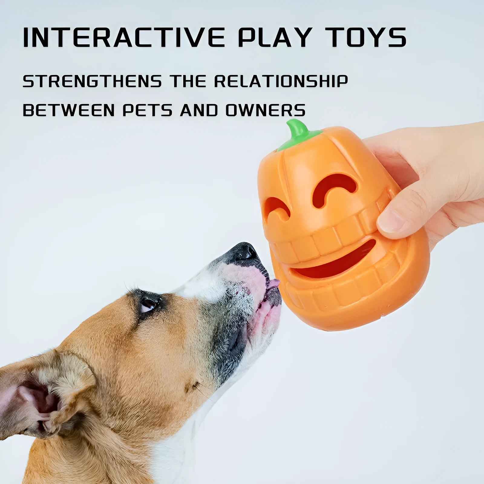 Orange Halloween pumpkin shaped dog chew toy with treat dispensing openings