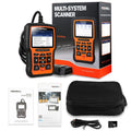 Foxwell NT510 orange and black automotive diagnostic scanner with data cable on a workshop bench.
