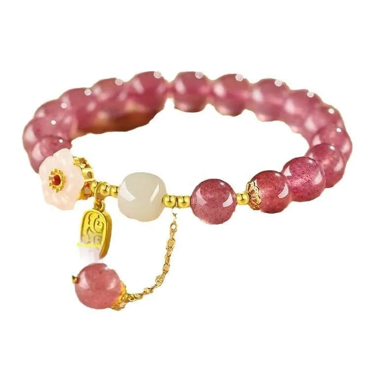 Handmade women's bracelet with Hetian jade and strawberry quartz crystals in peach blossom design