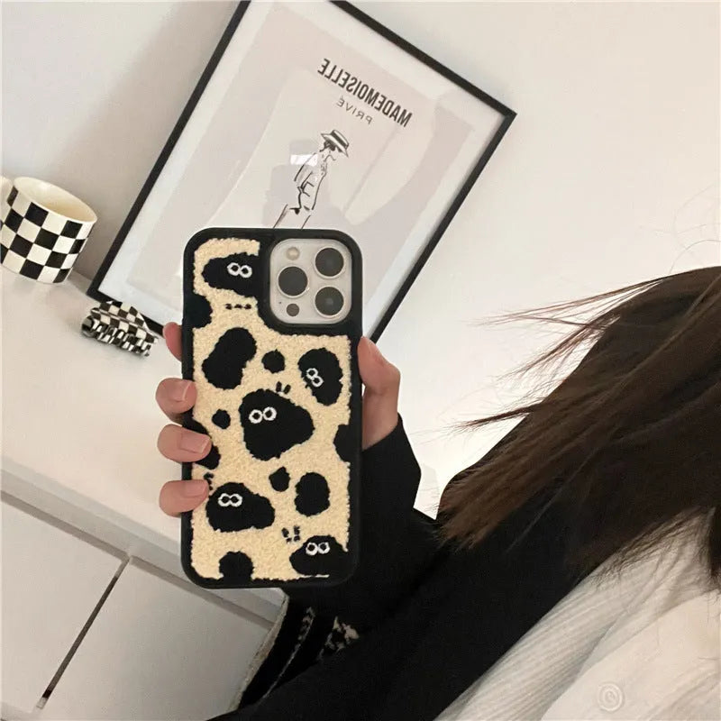 Black plush phone case with a Fairy design for iPhone models