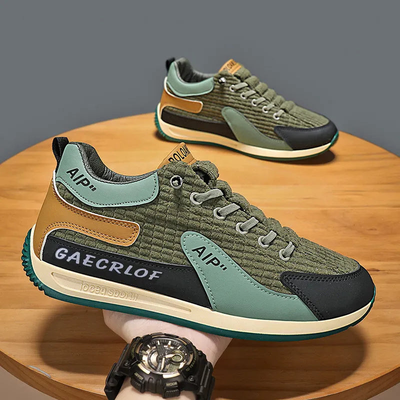 Men's green and grey low-top mesh running shoes with lace-up front and round toe.