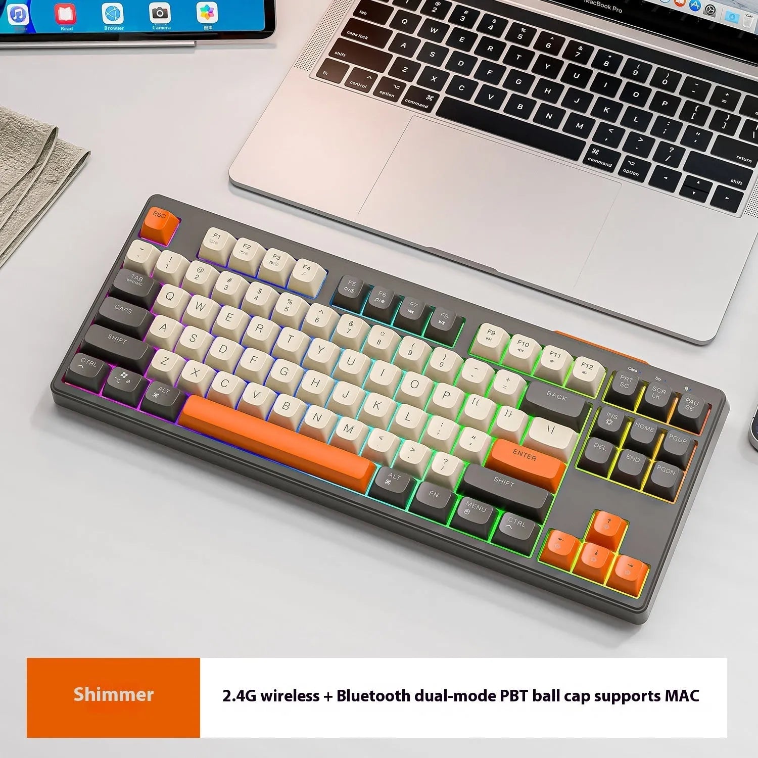 Compact wireless Bluetooth keyboard in blueberry colour with USB receiver and cable on a desk.
