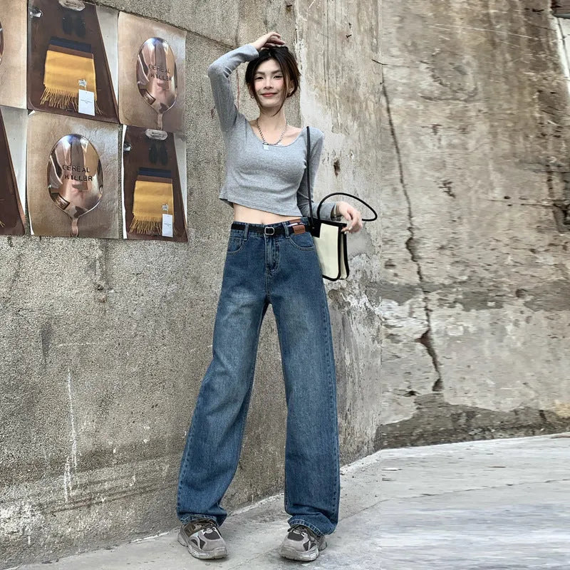 Women's high-waist retro blue straight-leg jeans on a hanger, showing the classic fit.