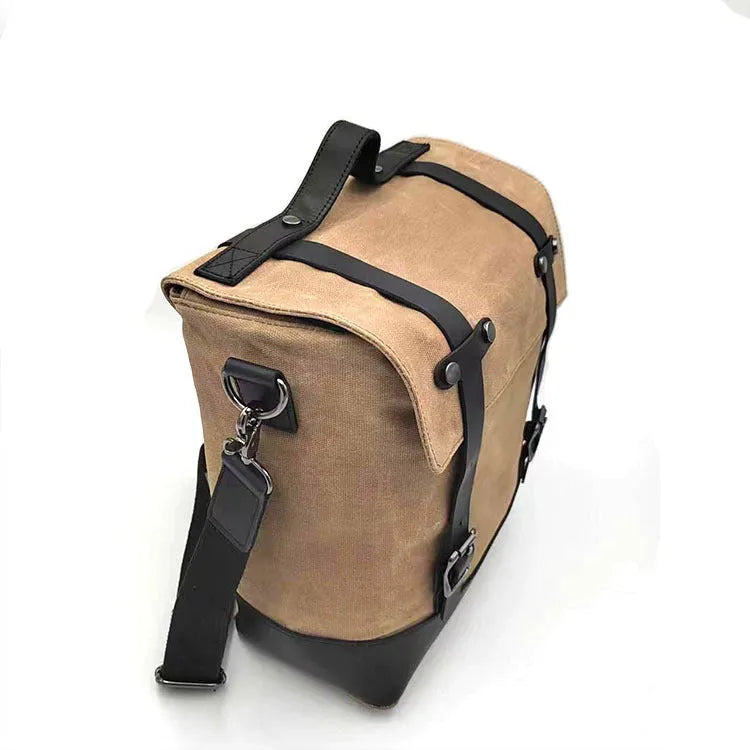 Black waterproof canvas motorcycle side bag with dimensions 300x280x150mm mounted on motorcycle