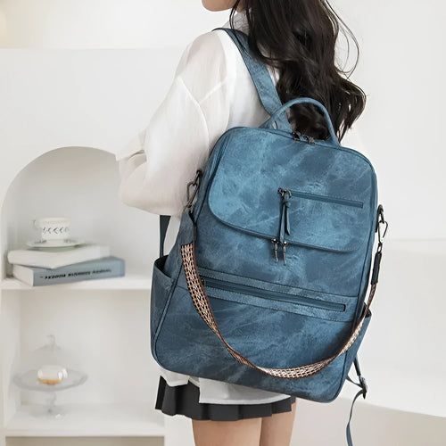 Retro solid colour PU backpack with curved shoulder straps shown in black.