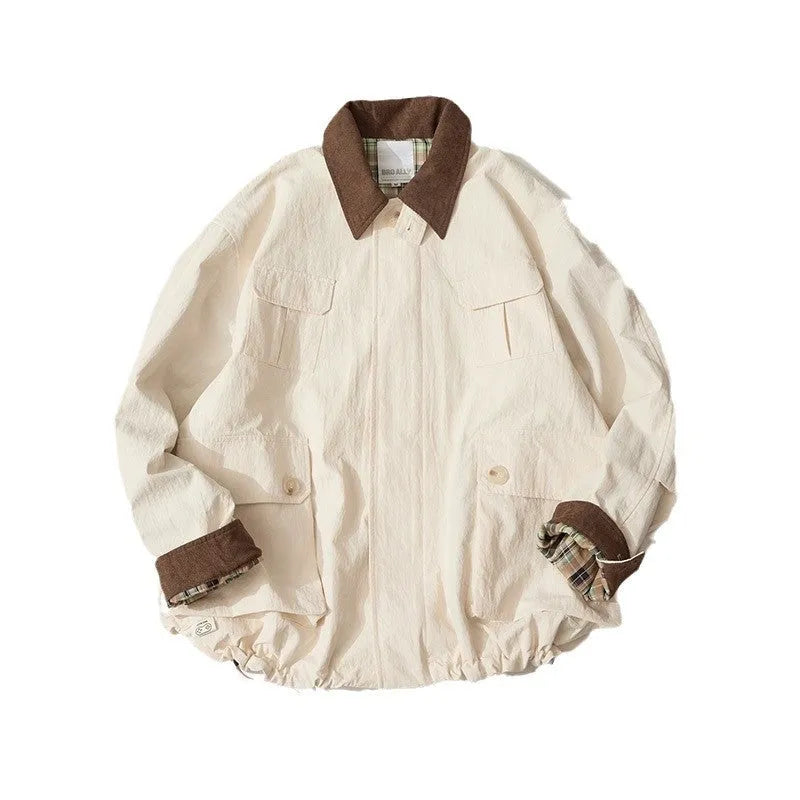 Casual apricot and green polyester jacket with side seam pockets on a hanger.