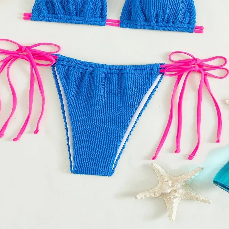 Women's solid colour lace-up one-piece swimsuit in nylon fabric.