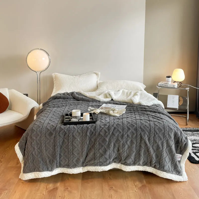 Polyester winter thermal flannel blanket in beige, laid flat showing its texture and simple modern style.