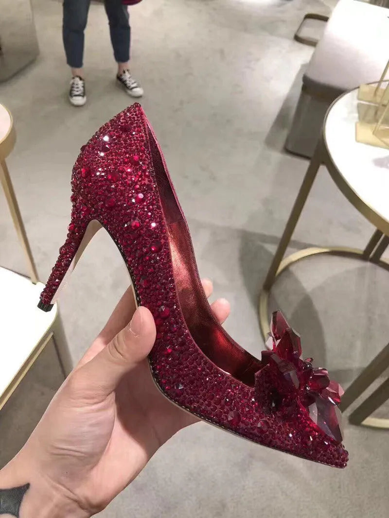 Gold women's pointed toe stiletto heels with rhinestone and sequin decoration on a 7cm heel.