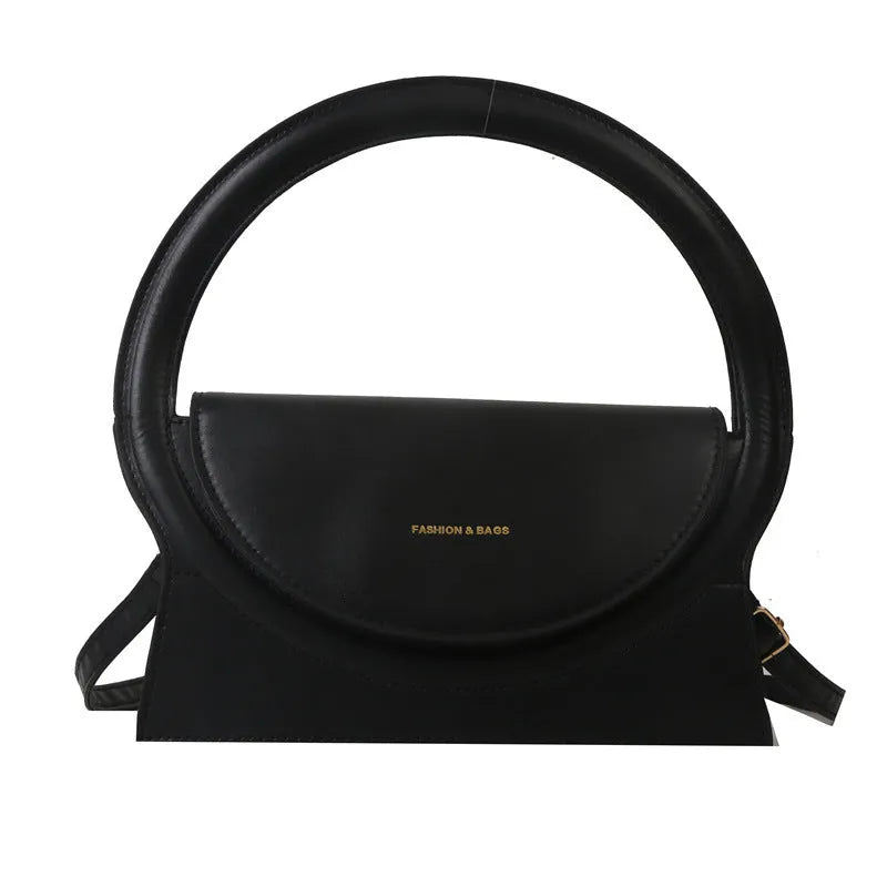 Horizontal square messenger bag in black with stitching detail and shoulder strap