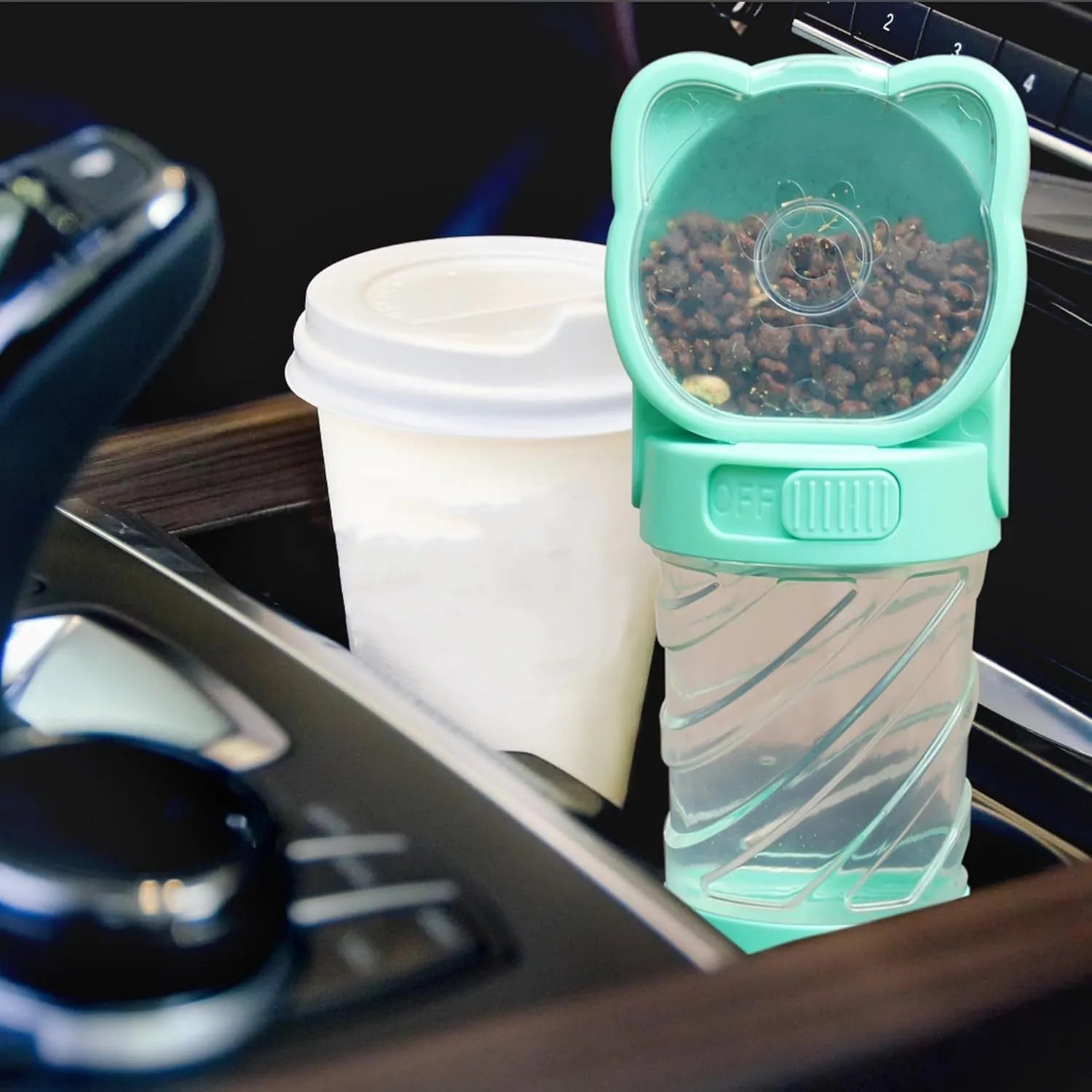 Green, pink, or white 3-in-1 portable pet water bottle with food container and garbage bag dispenser attached to a strap.