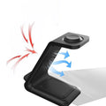 White upright dual coil wireless charger stand holding a mobile phone at an angle.
