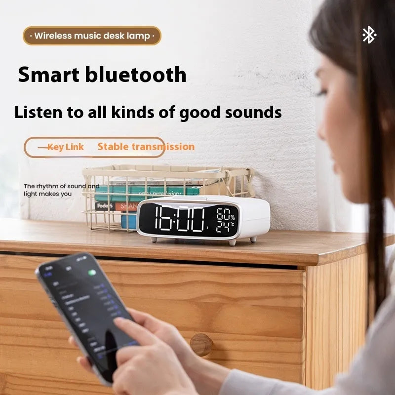White wireless charging speaker alarm clock with Bluetooth and night light functions