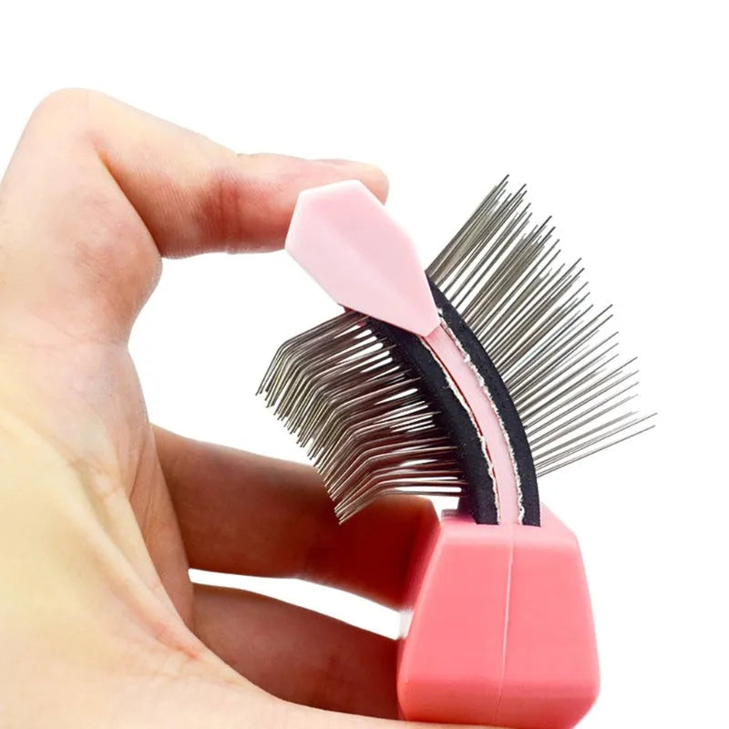 Blue double-sided pet brush with stainless steel pins on one side and soft bristles on the other, showing ergonomic handle.