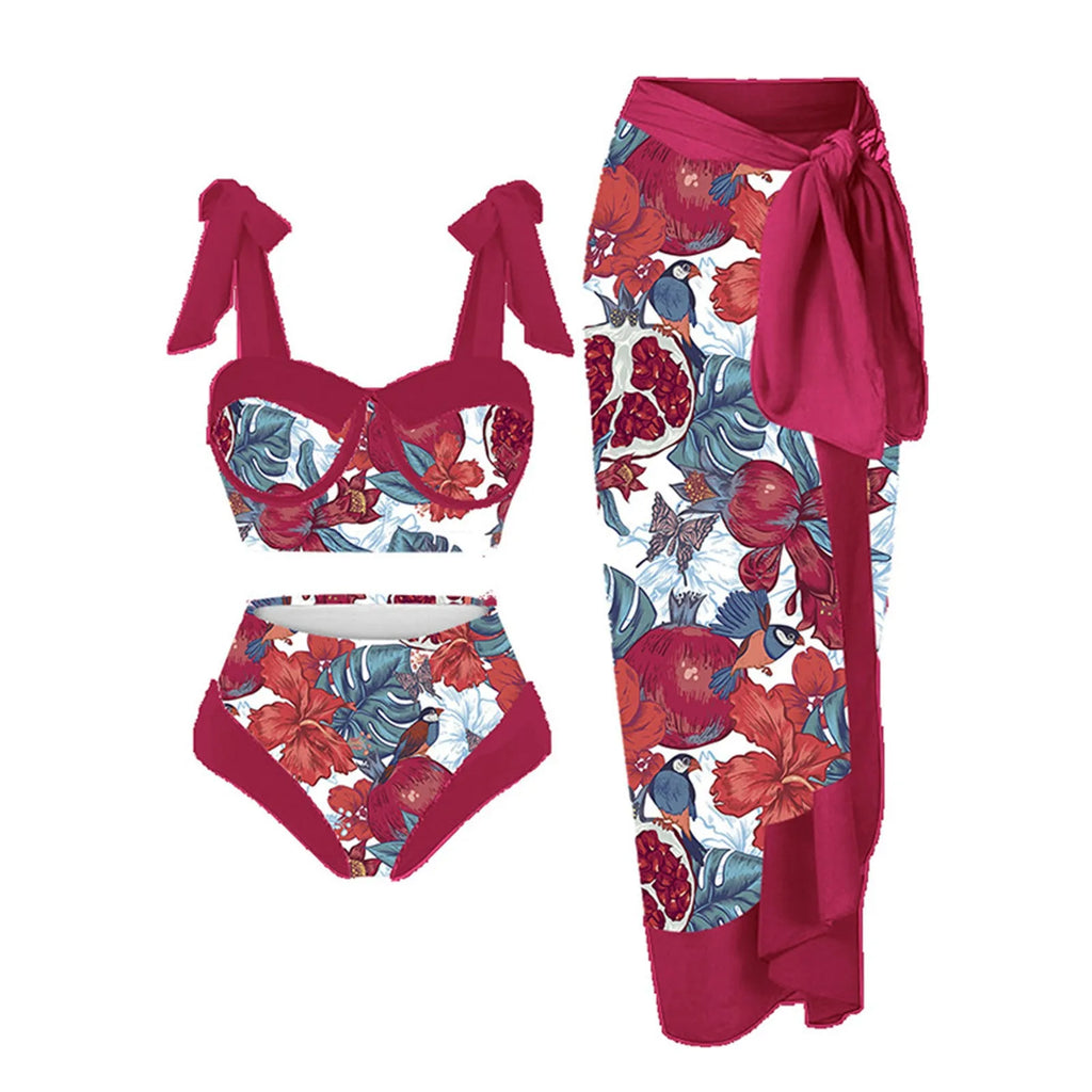 Women's pink floral print three-piece swimsuit set with skirt on a mannequin.