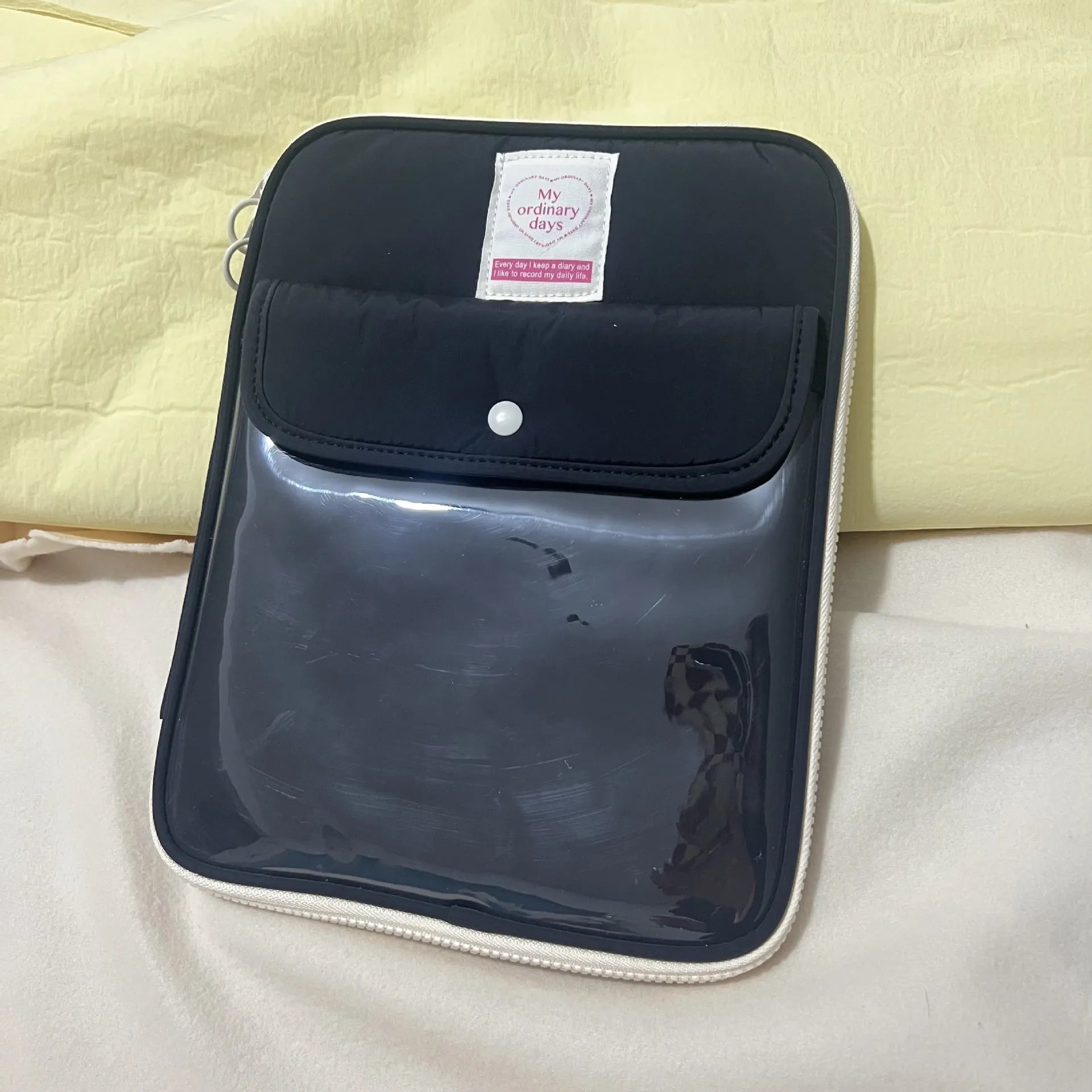 Nylon snap closure tablet bag in five colour options showing black, blue, lotus root, white and yellow variations