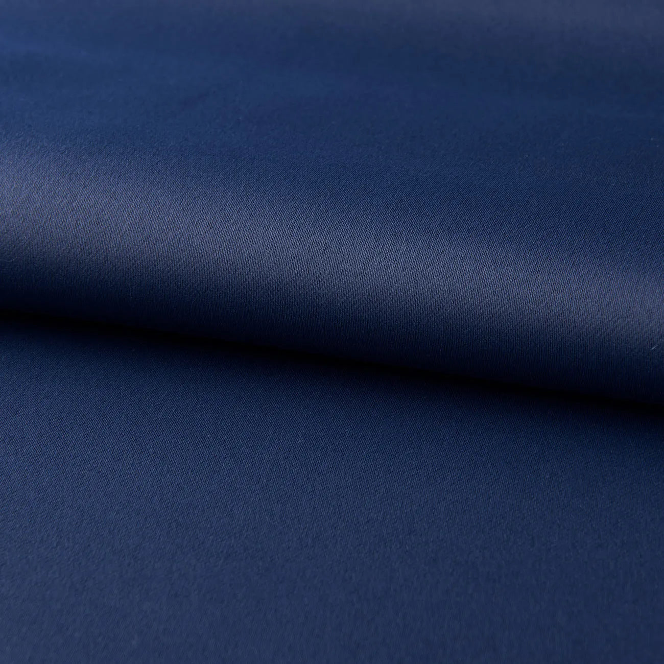 Dark navy blue modern blackout curtain made from shading cloth, hanging as a finished vertical panel.