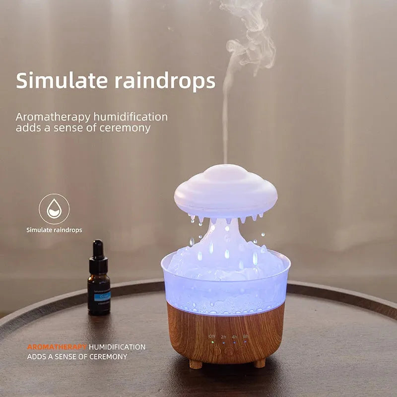 Wood grain rain cloud shaped humidifier and essential oil diffuser with night light on a table.