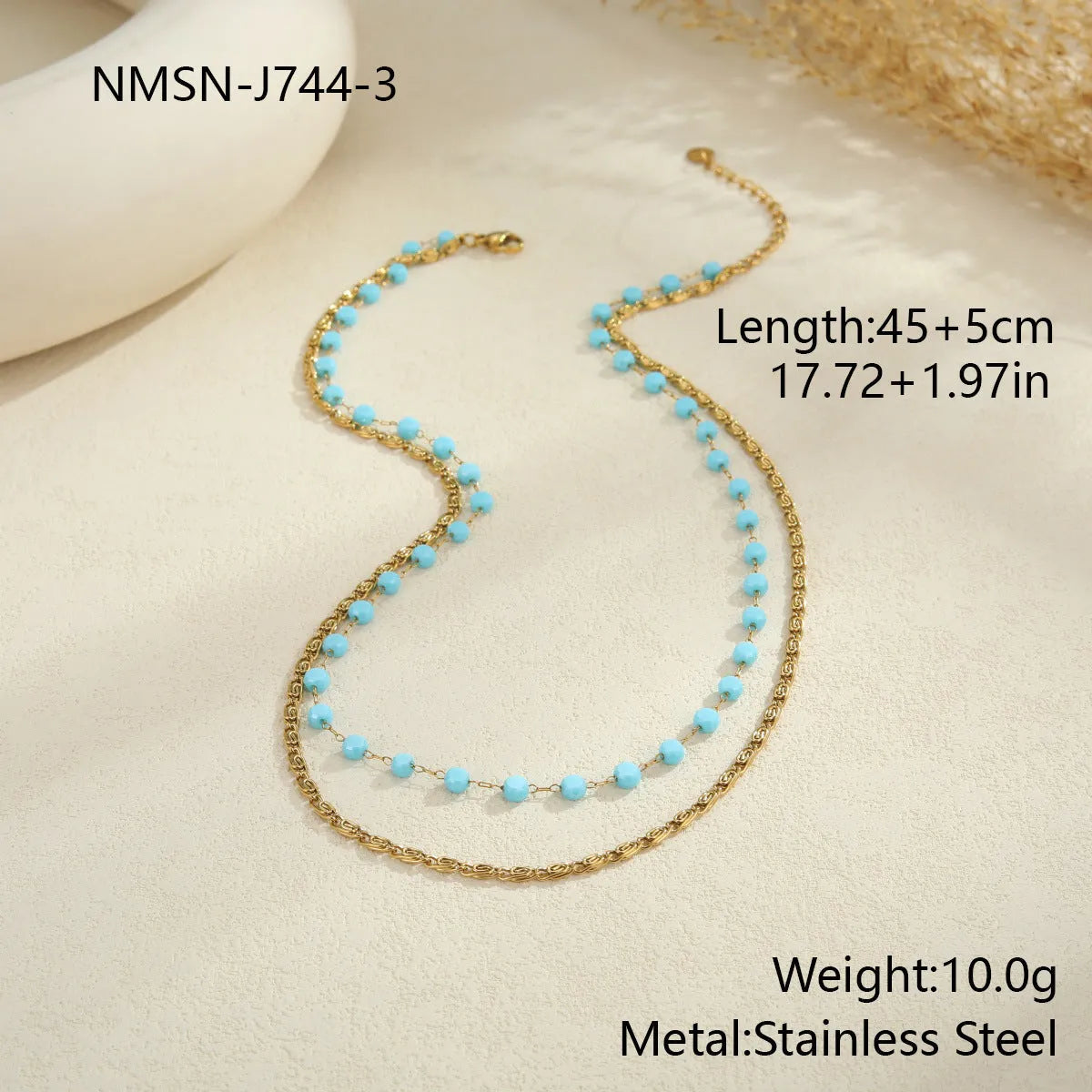 Stainless steel zircon necklace clavicle chain with beaded blue bracelet set geometric pendant on white background