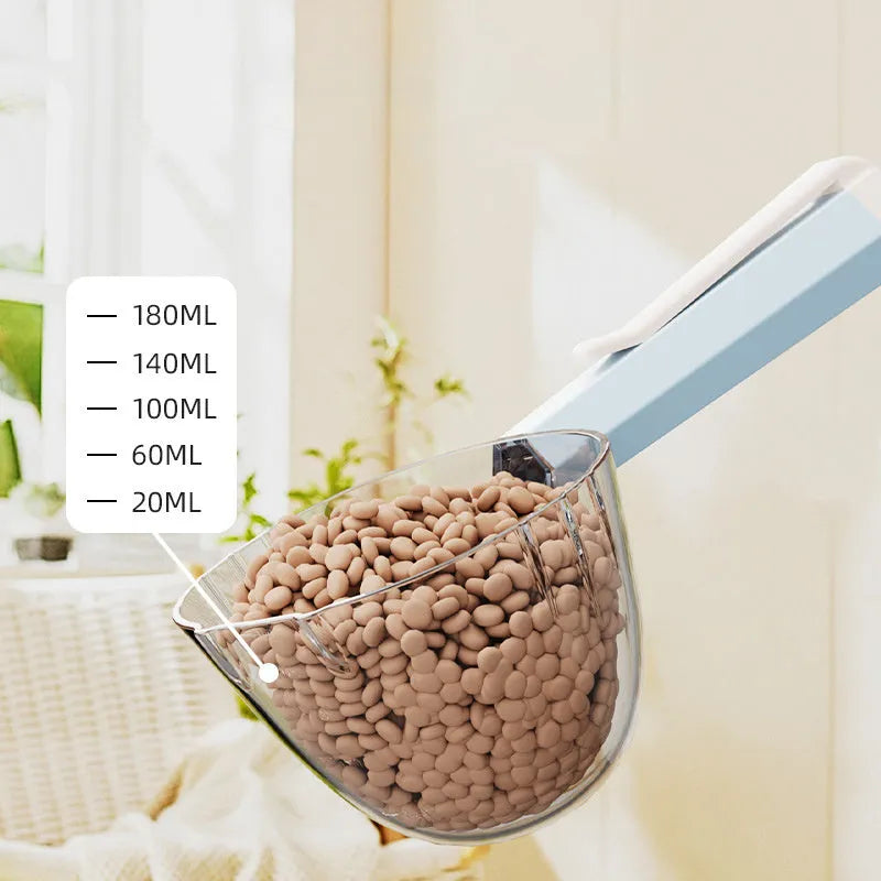 Blue pet food spoon with metal clip attached to a dog food tin.