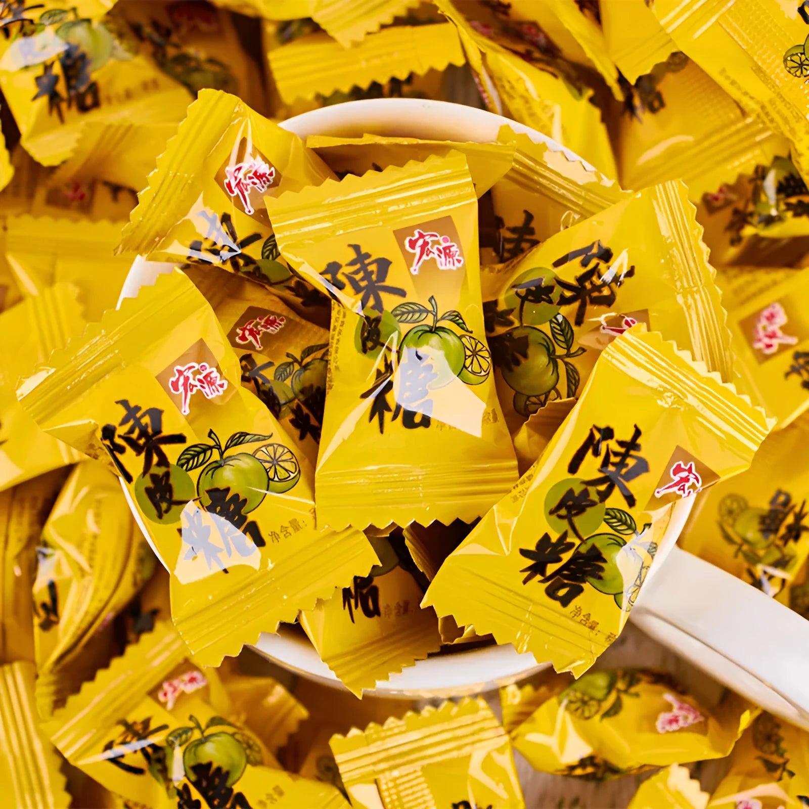 Assortment of Chinese fruit hard candies: plum sugar, guava and tangerine peel flavours in separate packets.