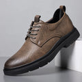 Men's black leather casual sneakers with sewing line detail and a rubber sole.