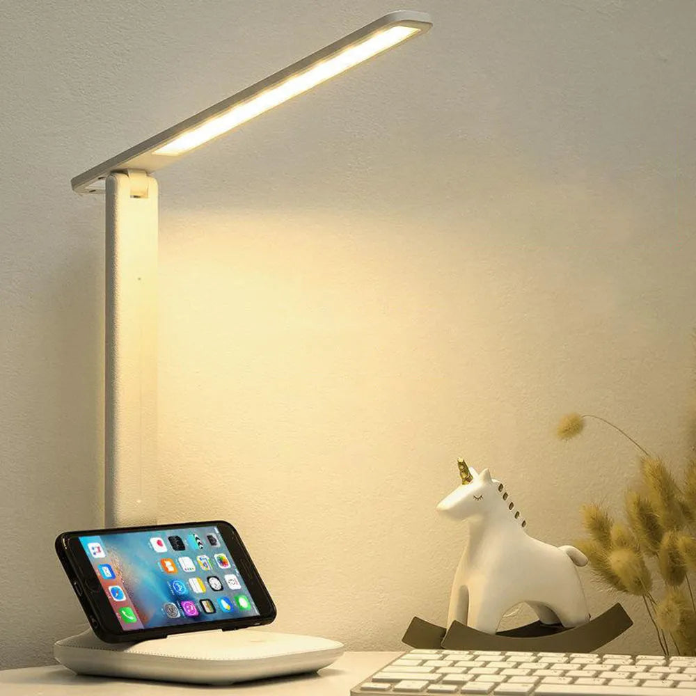 White plastic USB rechargeable bedside lamp with touch dimming for children's bedrooms.