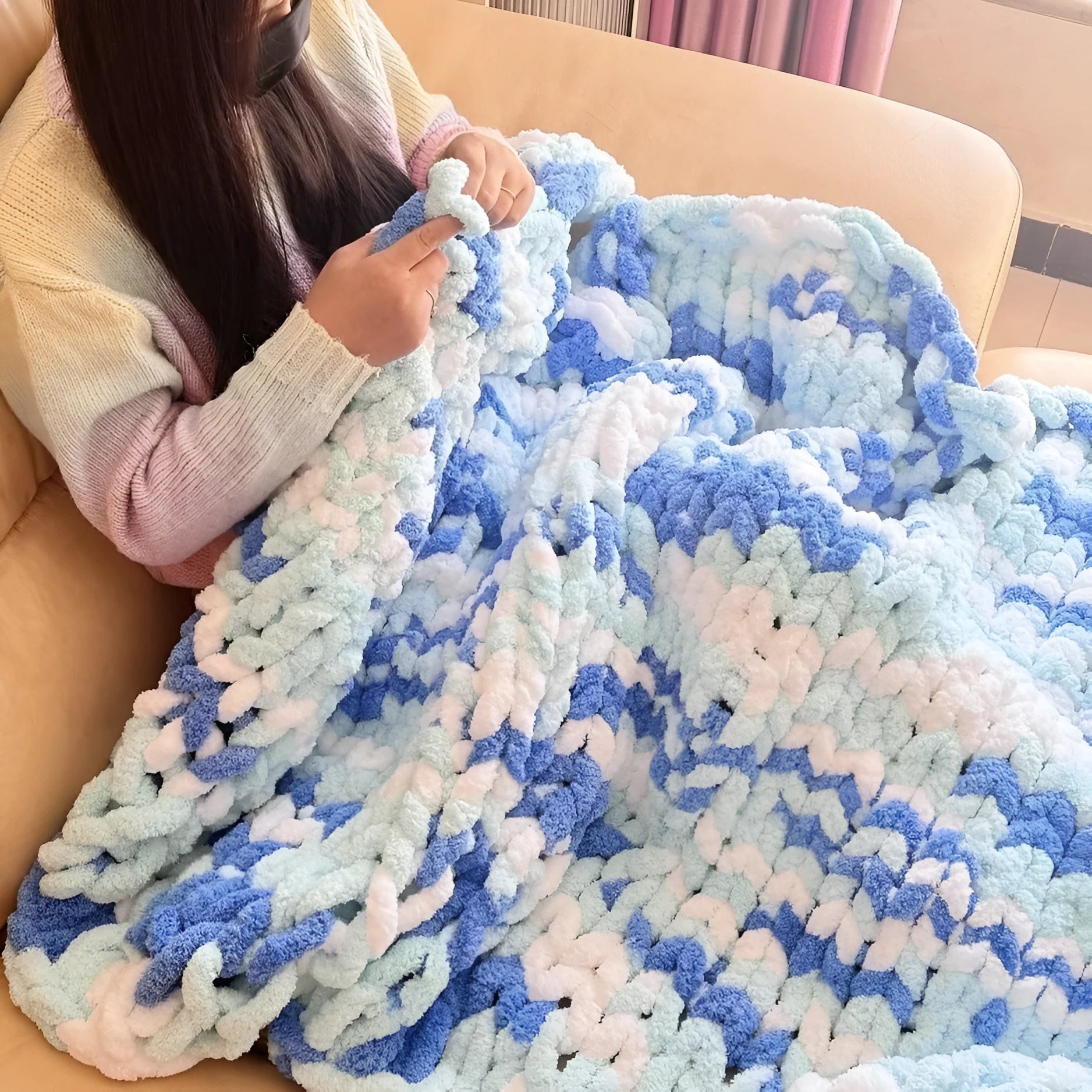Coarse yarn chenille knitted blanket with braided gravity detail in modern colour option