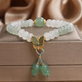 Green Tian Shan Cui abacus bead bracelet with crystal construction and butterfly tassel charms