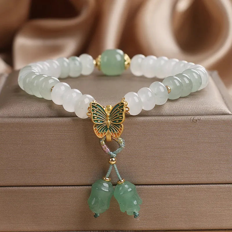 Green Tian Shan Cui abacus bead bracelet with crystal construction and butterfly tassel charms