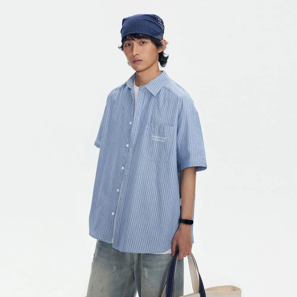 Blue striped loose fit overalls shirt with short sleeves and cardigan style design