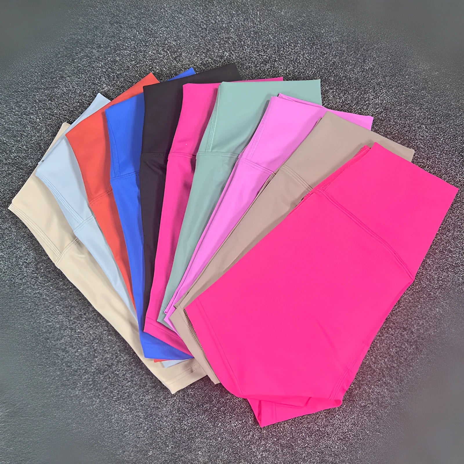 Women's high-waisted yoga shorts in quick-dry nylon, shown in a selection of available colours.