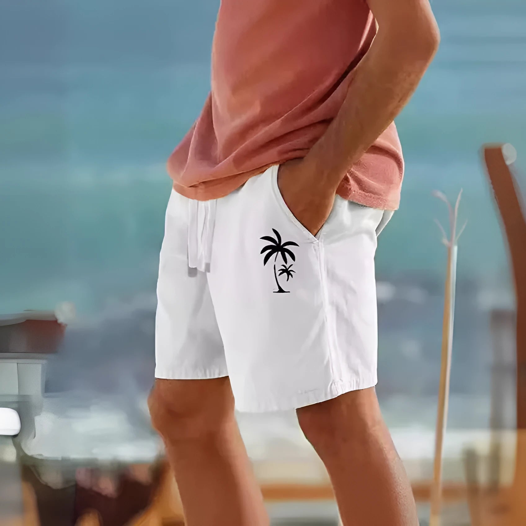 Men's army green cotton blend drawstring shorts with a floral heat transfer patch on the leg.