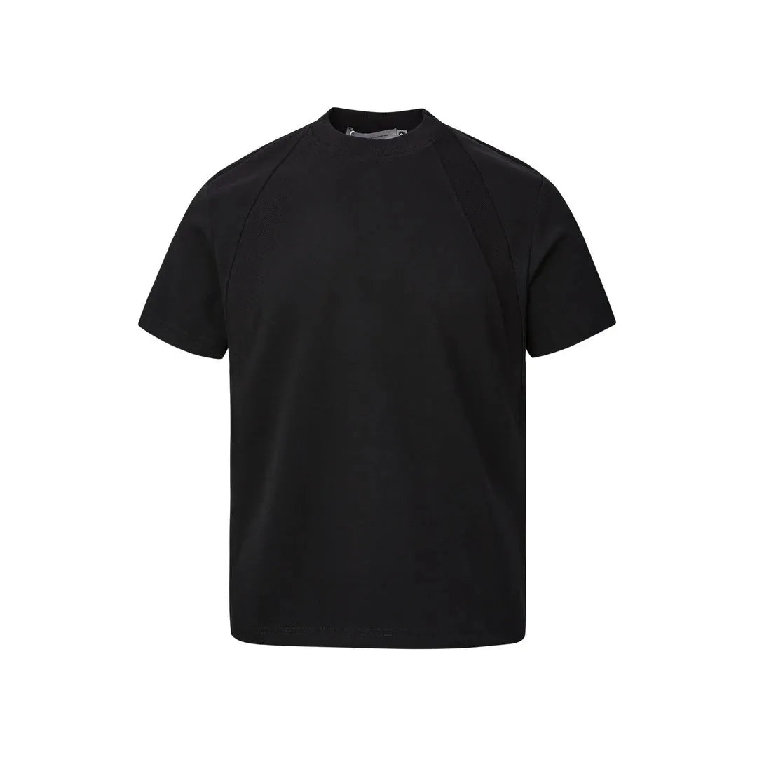 Men's loose fit short sleeve top in black with air layer stitching detail on a grey background.