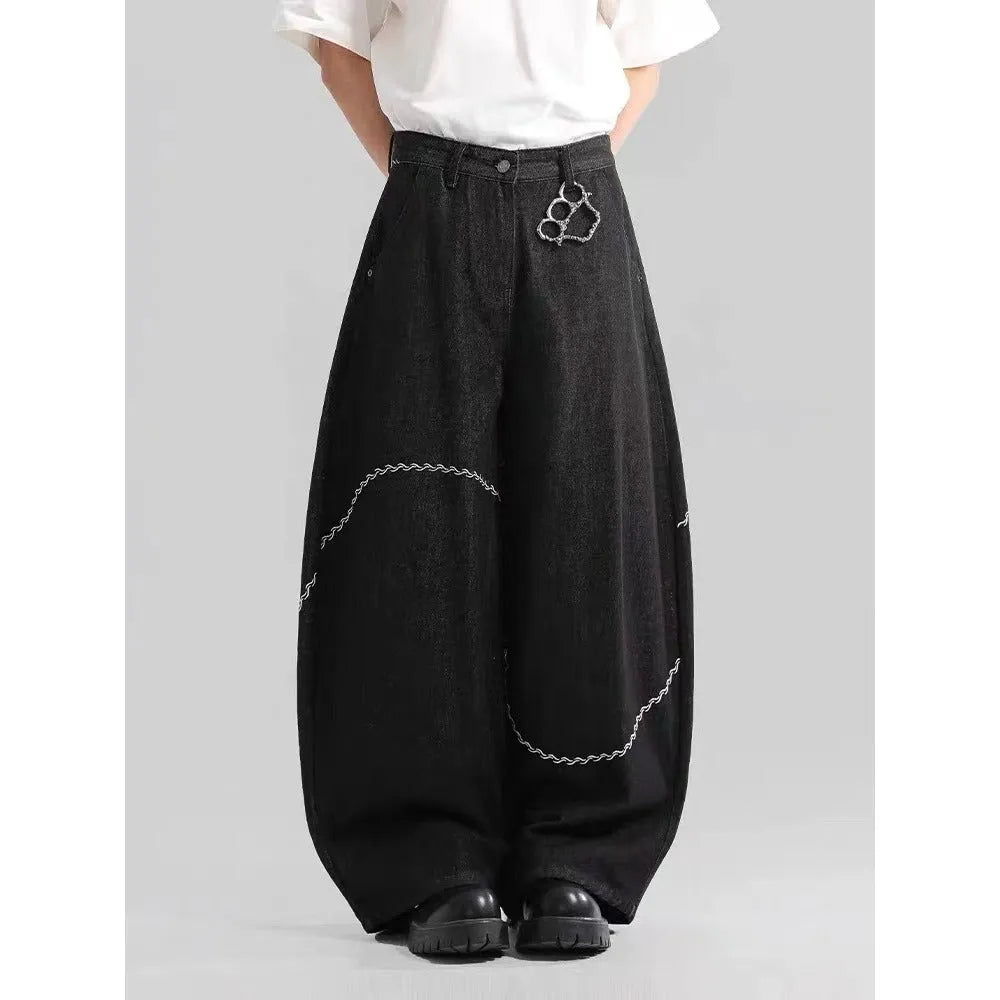 Black straight leg denim trousers with micro elastic waistband and zip fly placket detail