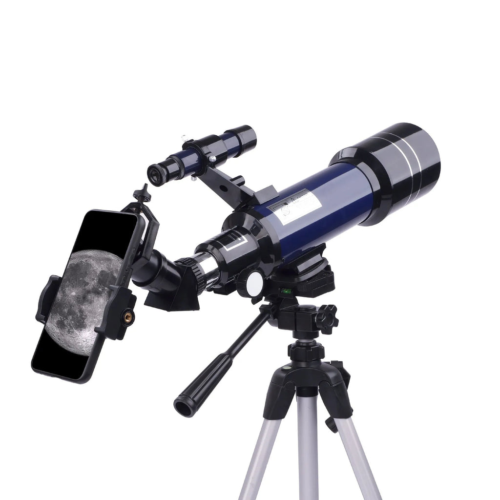 Dark blue children's astronomical telescope with adjustable magnification on a tripod, next to a mobile phone holder accessory.