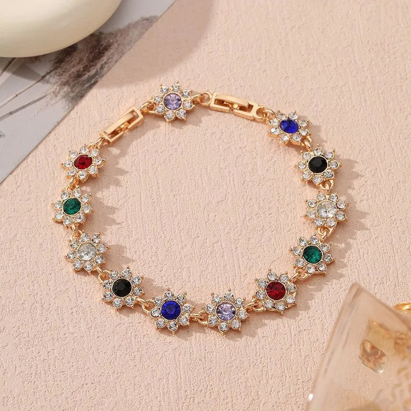 Floral zinc alloy bracelet in electroplated gold and silver colour variants with crystal and diamond effects