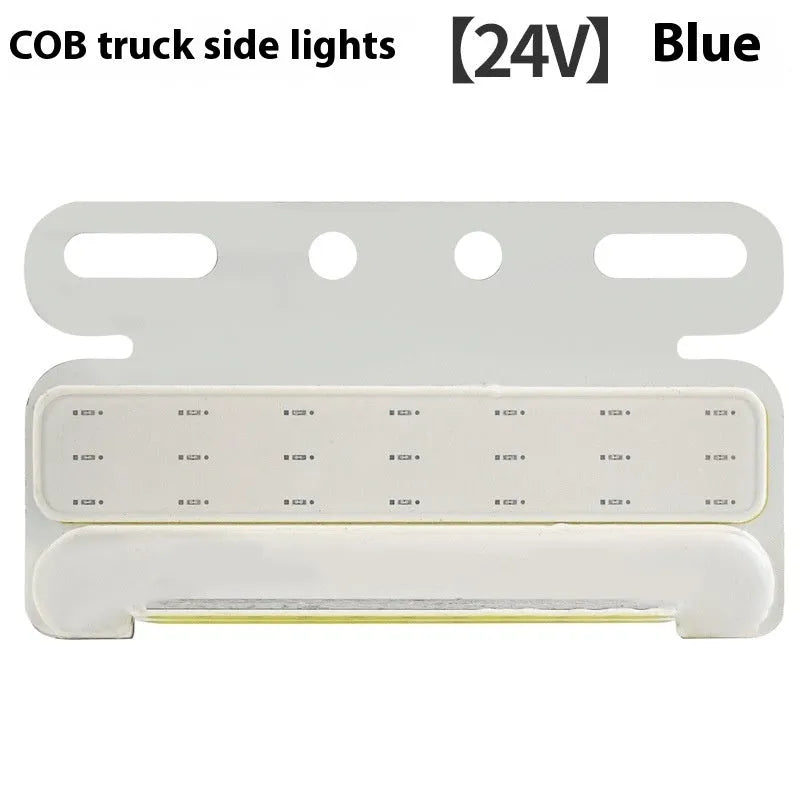 Aluminium alloy COB LED truck side light projecting bright white light onto ground next to tyre.