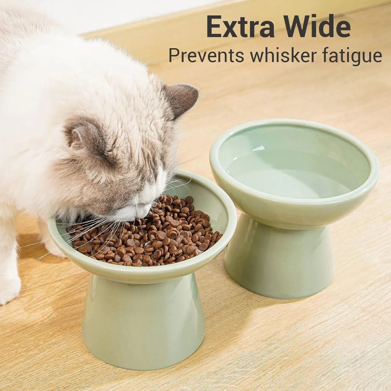 Ceramic elevated cat food bowl in blue colour with wide shallow design and raised base