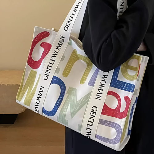 Large canvas women's tote bag with printed design, shown in available colour options.